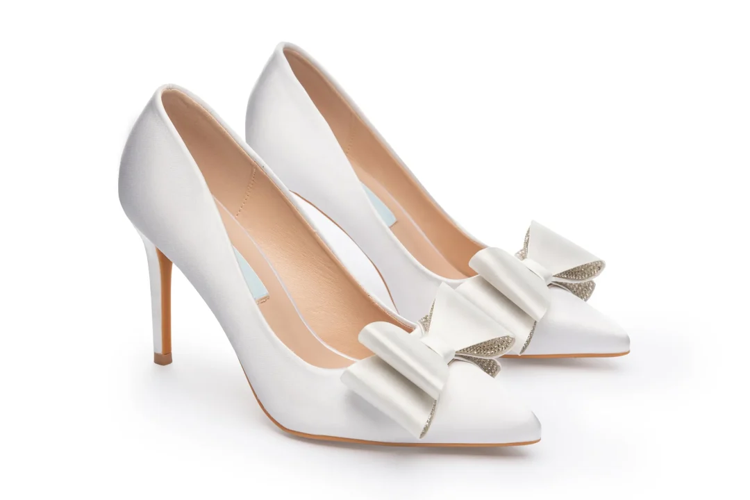 Pointed toe bridal stilettos in soft satin with romantic bow accent